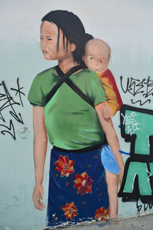 Mother carrying her kid